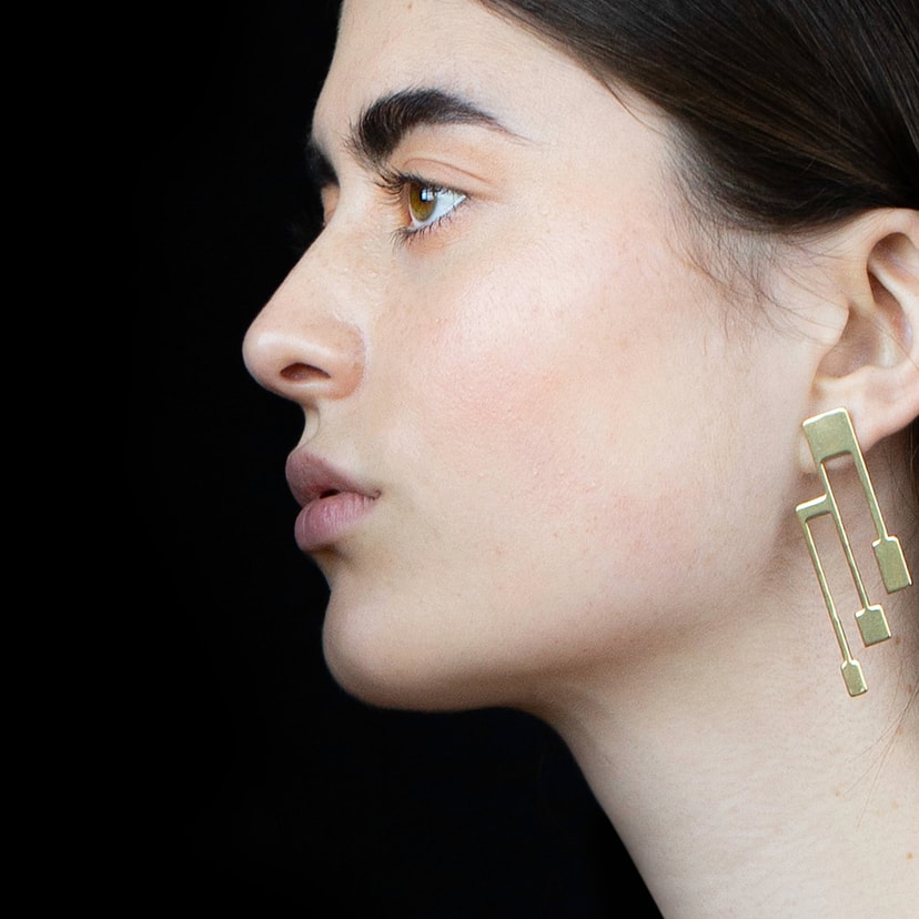 croon tritant , earrings , brass