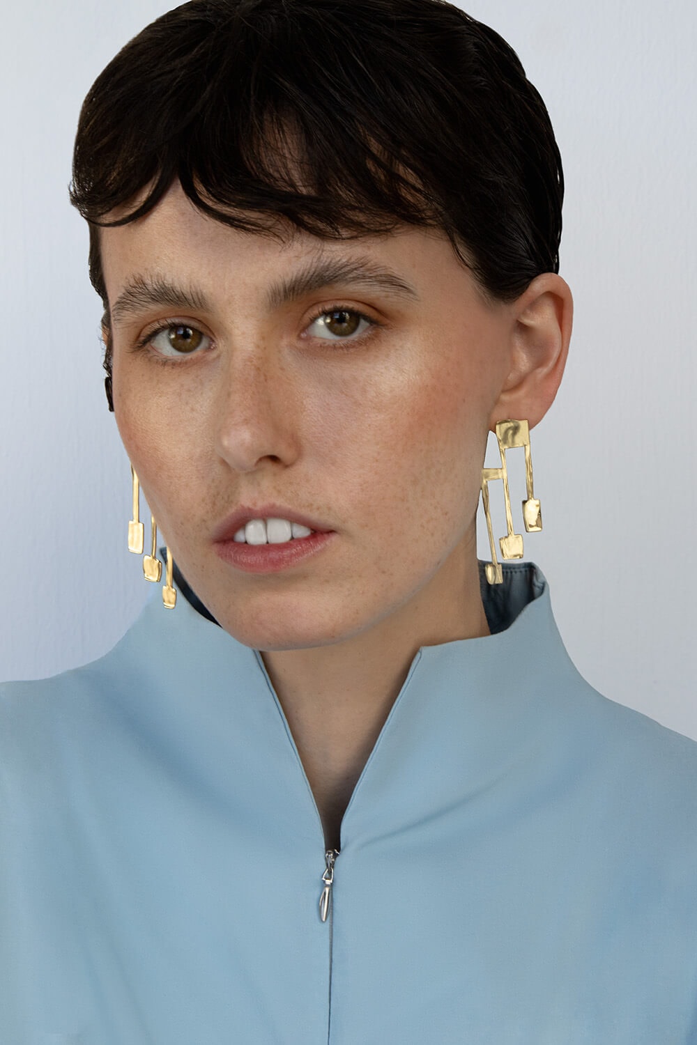 OLONG , EARRINGS , BODY , TRIDENT , BRASS