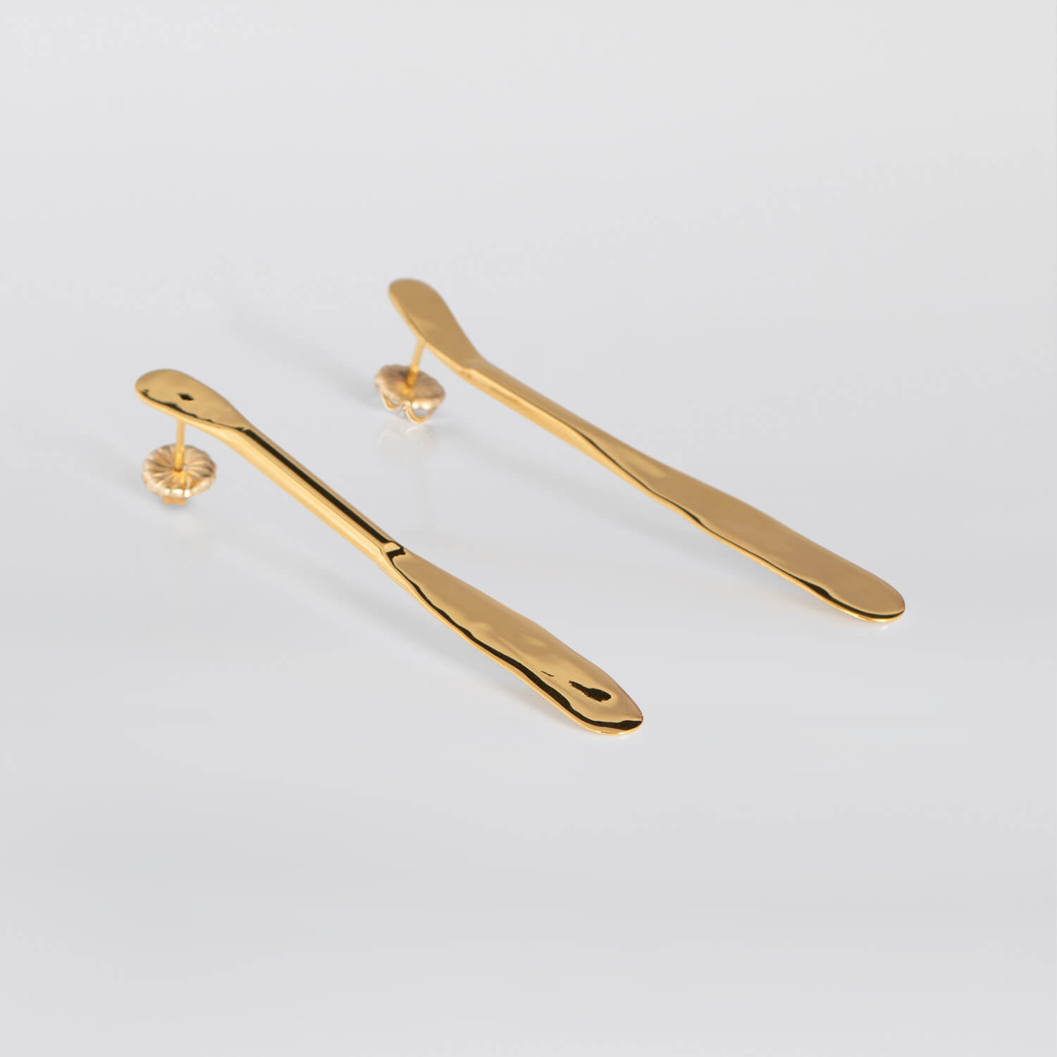 MIRR_FLAT_EARRINGS_LAYING_24KRTGP_WEB.jpg