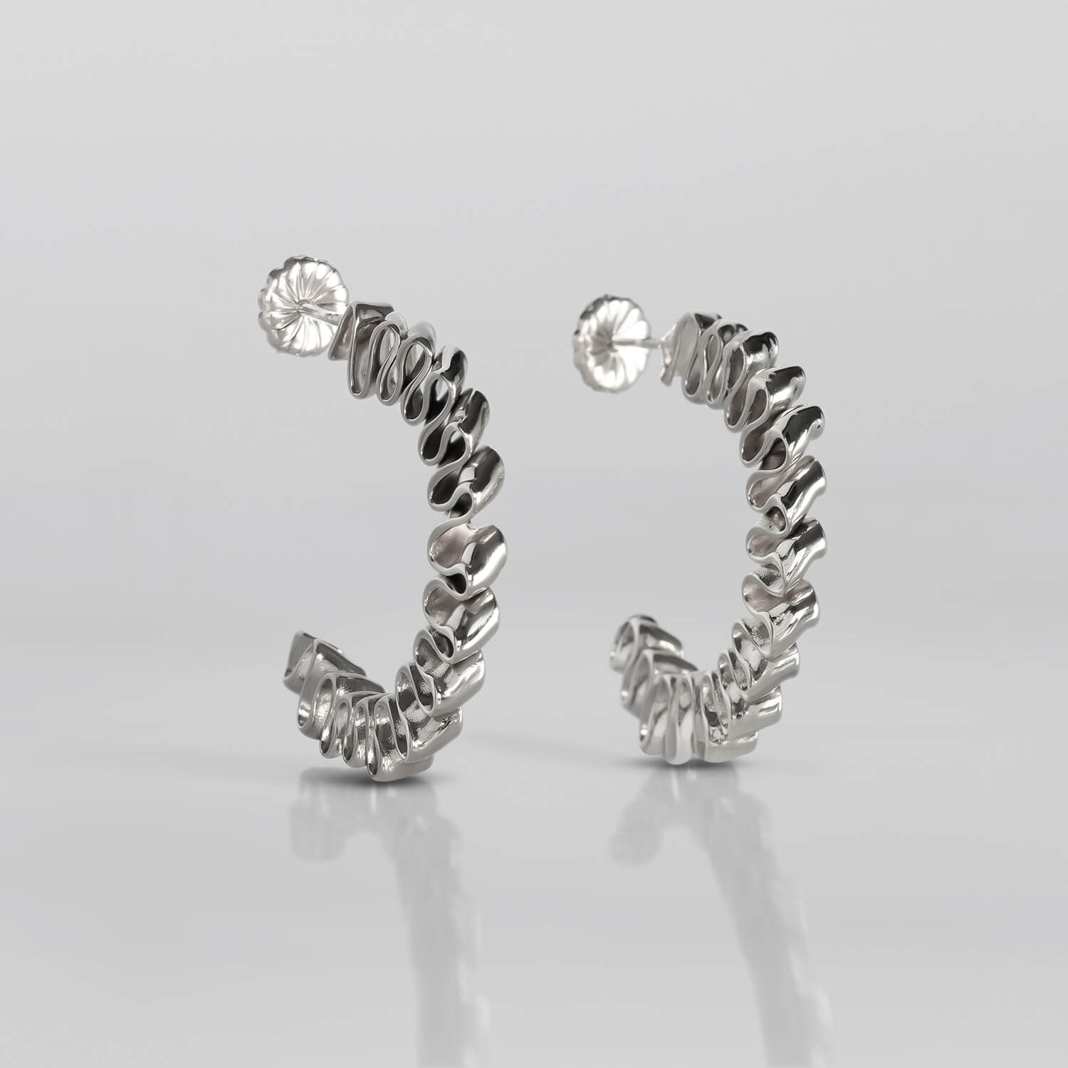 MIRR_WAVE_LOOPS_S_EARRINGS_FRONT_BRASS_WEB.jpg