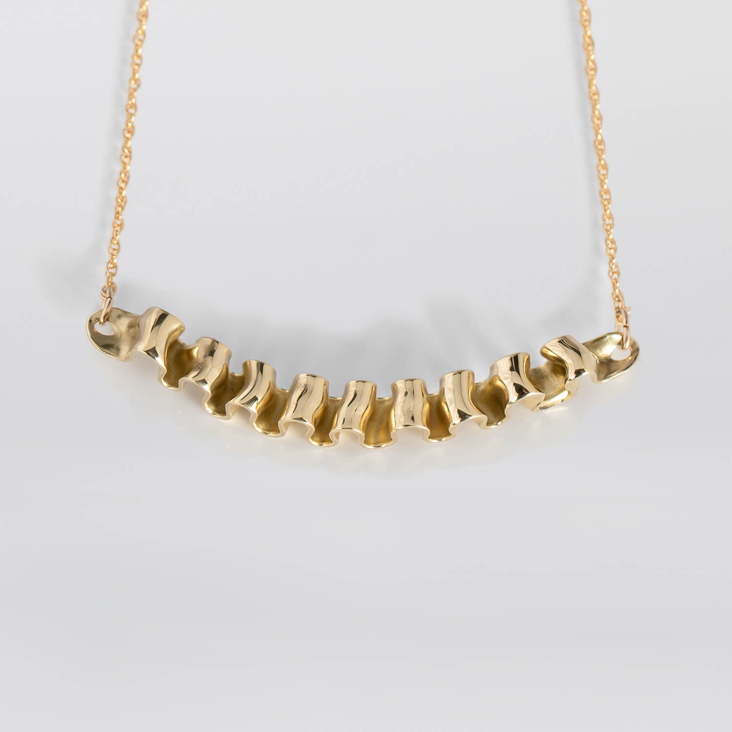 MIRR_WAVE_NECKLACE_FRONT_BRASS_WEB.jpg
