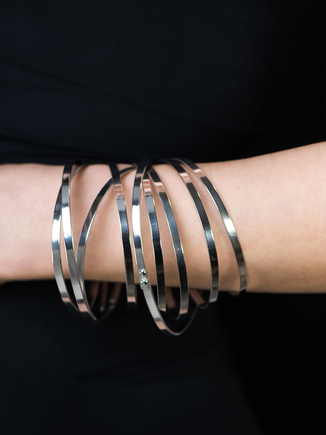 Close-up of model’s arm wearing Tweek Eek bracelets